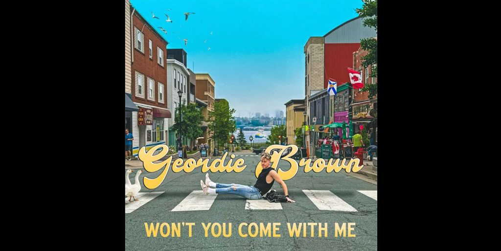 Geordie Brown poses on a crosswalk in Dartmouth for the Won’t You Come With Me cover art.