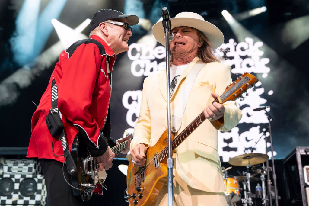 Cheap Trick Rock the Stage in Concert - Classic Rock Artists Cheap Trick performing live with energy and style on stage.