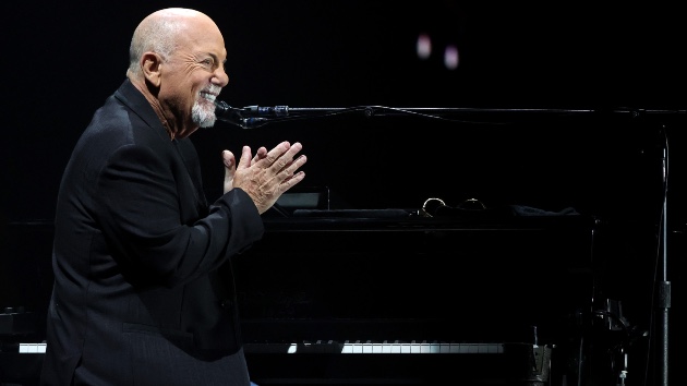 Billy Joel on Stage at Allegiant Stadium, Las Vegas – November 2024 - Classic Rock Artists Billy Joel Vault performance as the singer plays piano and smiles at Allegiant Stadium in Las Vegas, November 9, 2024.