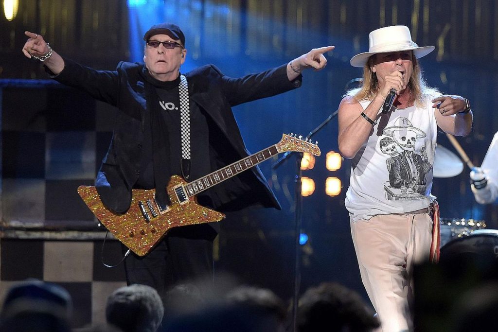 Cheap Trick Shows with guitarist and singer performing live on stage