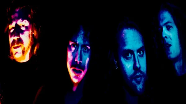 Metallica Interview: Rare 1991 Band Photo from Thrash Metal Denial Era - Classic Rock Artists Metallica interview era promotional photo showing four band members in dramatic colored lighting against black background, captured during their 1991 period when they denied being a thrash metal band.