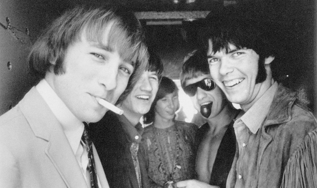 Members of Buffalo Springfield in black and white promotional photo from 1966 showing the original lineup of the influential folk rock band.