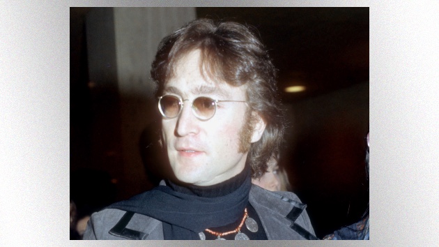 John Lennon wearing his famous tinted prescription glasses during the Lost Weekend era - Classic Rock Artists John Lennon glasses tinted prescription Lost Weekend period 1974 Beatles musician classic rock.