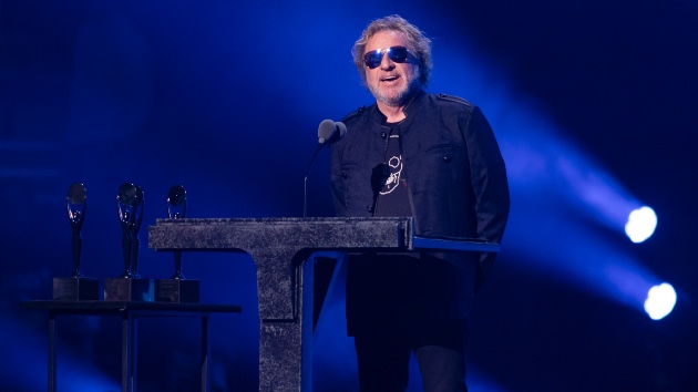 Sammy Hagar Shares Van Halen Denver Blizzard Concert Memories - Classic Rock Artists Sammy Hagar performing at concert discussing Van Halen Denver blizzard 1995 performance with microphone and stage lights