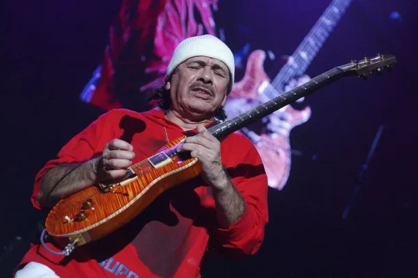 Carlos Santana Performs Live - 2026 Concert Dates Announced - Classic Rock Artists Carlos Santana playing his signature PRS guitar during a live performance, announcing Santana 2026 concert dates for his Las Vegas residency.