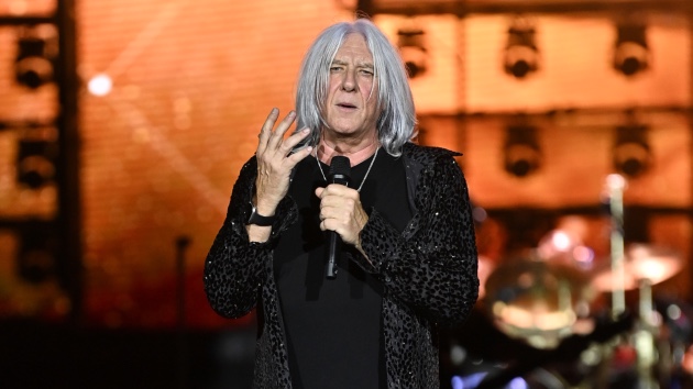 Def Leppard Frontman Joe Elliott Live Performance - Summer Stadium Tour 2024 - Classic Rock Artists Joe Elliott of Def Leppard performing live on stage with microphone, announcing details about Def Leppard new album during Summer Stadium tour at Truist Park in Atlanta.