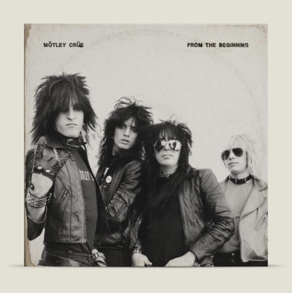 Mötley Crüe - From the Beginning Album Cover - Classic Rock Artists Mötley Crüe From the Beginning album cover showing the classic rock band in black leather outfits and sunglasses, released during Vince Neil stroke recovery and Vegas residency launch.