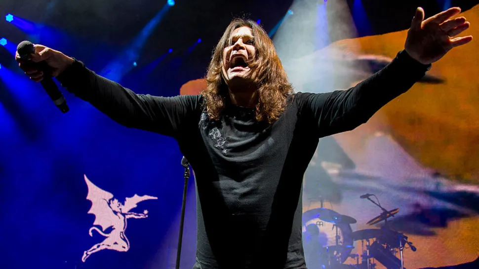 https://claude.ai/chat/38c53777-d3df-4e5b-bf01-9e214ced9dcf#:~:text=Rock%20Star%20Performing%20Live%20During%20Ozzy%20Osbourne%20Tribute%20Concert - Classic Rock Artists Ozzy Osbourne tribute performer on stage with arms raised during live rock concert with dramatic blue and orange lighting.