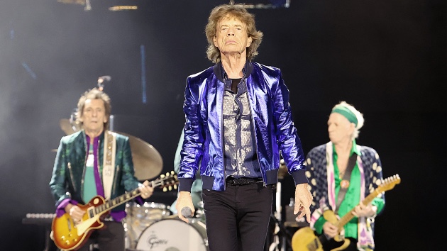Rolling Stones IMAX concert film legends Mick Jagger, Keith Richards, and Ronnie Wood performing live on stage.