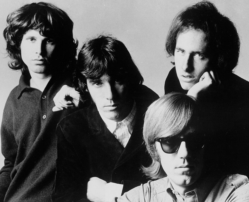 Black and white promotional photograph of members of The Doors from 1968, showing all four band members.