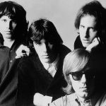 Black and white promotional photograph of members of The Doors from 1968, showing all four band members.
