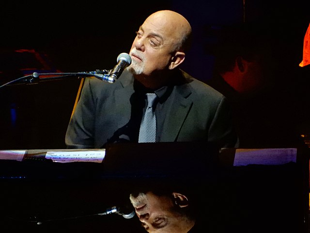 Billy Joel performing live at Nassau Veterans Memorial Coliseum with piano