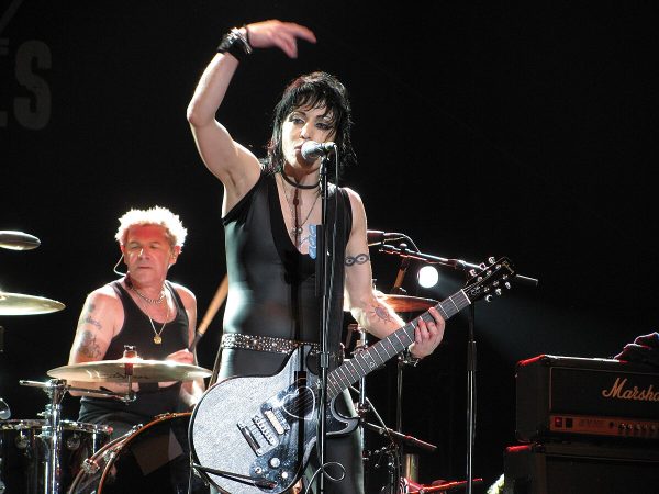 Joan Jett Tour 2026 - Rock Icon Performing Live on Stage Joan Jett performing live on stage with guitar during joan jett tour 2026 announcement concert