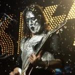 Kiss Ace Frehley tribute performance showing band member on stage with guitar during emotional Las Vegas show.
