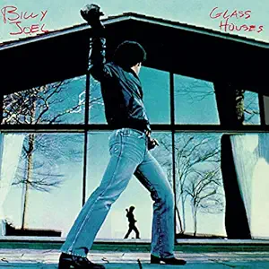 Glass Houses by Billy Joel album cover 1980 showing Billy Joel throwing rock through window