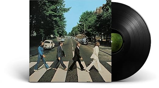 Abbey Road by The Beatles iconic 1969 album cover showing the band crossing zebra crossing.
