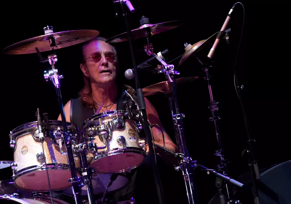 Foghat 2026 tour drummer Roger Earl performing live on stage behind drum kit