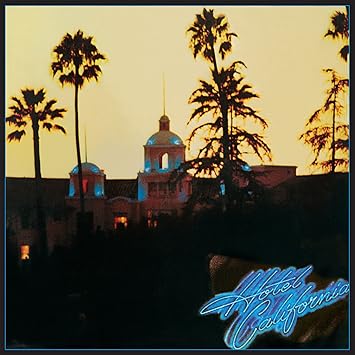 Hotel California album cover by the Eagles featuring the Beverly Hills Hotel at sunset with palm trees.
