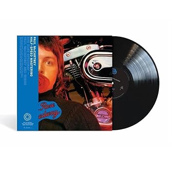 Red Rose Speedway by Paul McCartney and Wings vinyl album cover featuring Paul McCartney's face reflected in motorcycle helmet visor