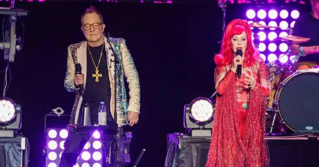 B-52s 2026 tour dates featuring Fred Schneider and Kate Pierson performing live on stage