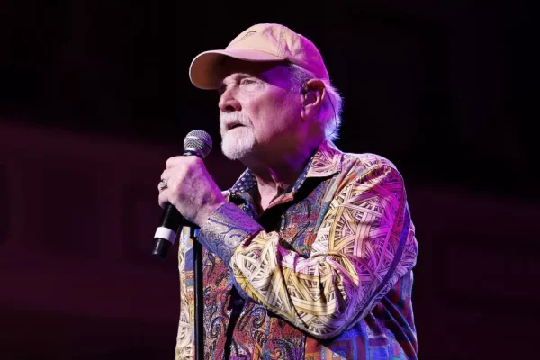 Mike Love Beach Boys Tour Performance Beach Boys tour 2024 Mike Love performing live on stage in colorful shirt
