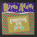 Bryan Adams Christmas Time 1985 green vinyl single cover featuring festive red and green striped design with holly decoration.