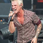 Jeff Gutt Stone Temple Pilots lead vocalist performing live on stage with microphone and powerful stage presence.