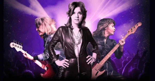 Suzi Quatro tour 2026 promotional image showing the rock legend in black leather with bass guitar against purple stage lighting