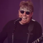 George Thorogood Tour 2026 promotional image featuring blues-rock legend with guitar preparing for North American concert dates.