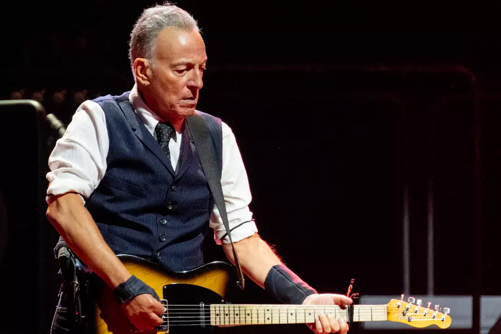 Bruce Springsteen performing live on stage with guitar during the Bruce Springsteen 2026 tour