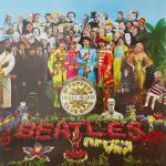 Sgt Peppers Lonely Hearts Club Band album cover featuring The Beatles and classic rock artists including Marilyn Monroe Bob Dylan and other cultural icons