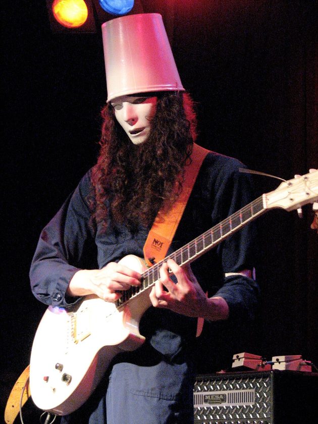 Buckethead performing live with Guns N' Roses Buckethead performing live with Guns N' Roses wearing his signature KFC bucket and white mask