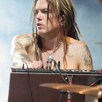 Dizzy Reed performing on stage with Guns N' Roses