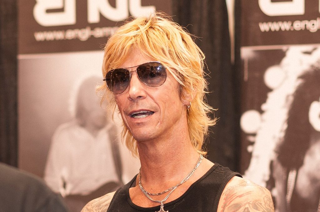 Duff McKagan performing live on stage with Guns N' Roses
