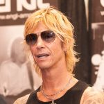 Duff McKagan performing live on stage with Guns N' Roses