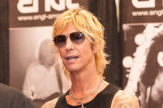 Duff McKagan performing live on stage with Guns N' Roses