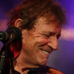 Jack Bruce performing live on stage, iconic bassist and vocalist of Cream