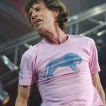 Mick Jagger performing live on stage in concert.