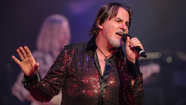 Tommy DeCarlo lead singer of Boston performing live on stage