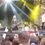 The legendary members of velvet revolver performing live on stage during their peak years.