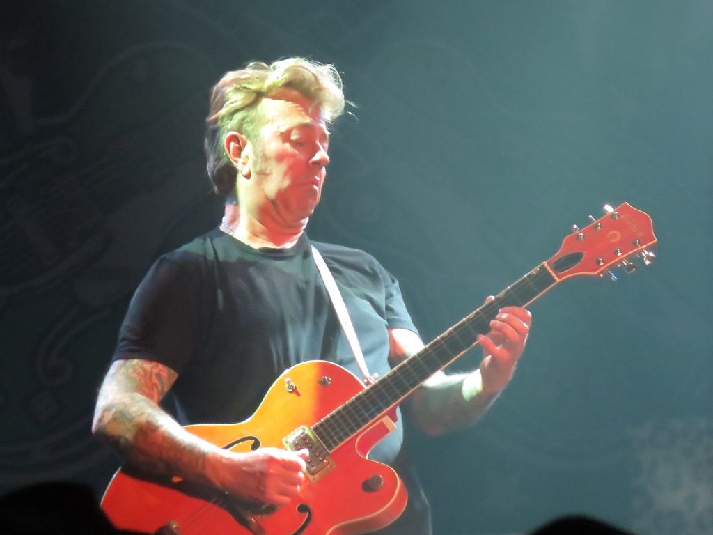 Brian Setzer playing his Gretsch guitar live on stage