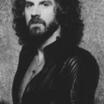 Geoff Nicholls portrait in black and white wearing a leather jacket.