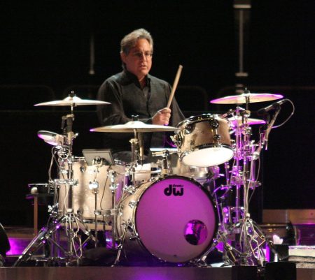 Max Weinberg performing live on drums with the E Street Band, powerful rock drummer known as Mighty Max