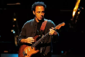 Nils Lofgren performing live on guitar with the E Street Band