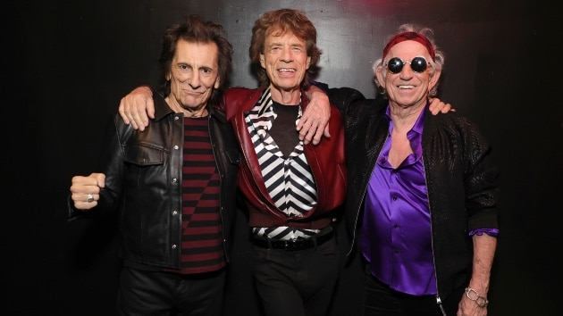 Foreign Tongues: Ronnie Wood, Mick Jagger, and Keith Richards of The Rolling Stones backstage