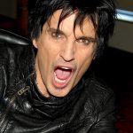 Tommy Lee playing drums live on stage, co-founder and drummer of Mötley Crüe