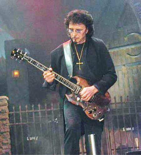 Tony Iommi performing live on stage with Black Sabbath