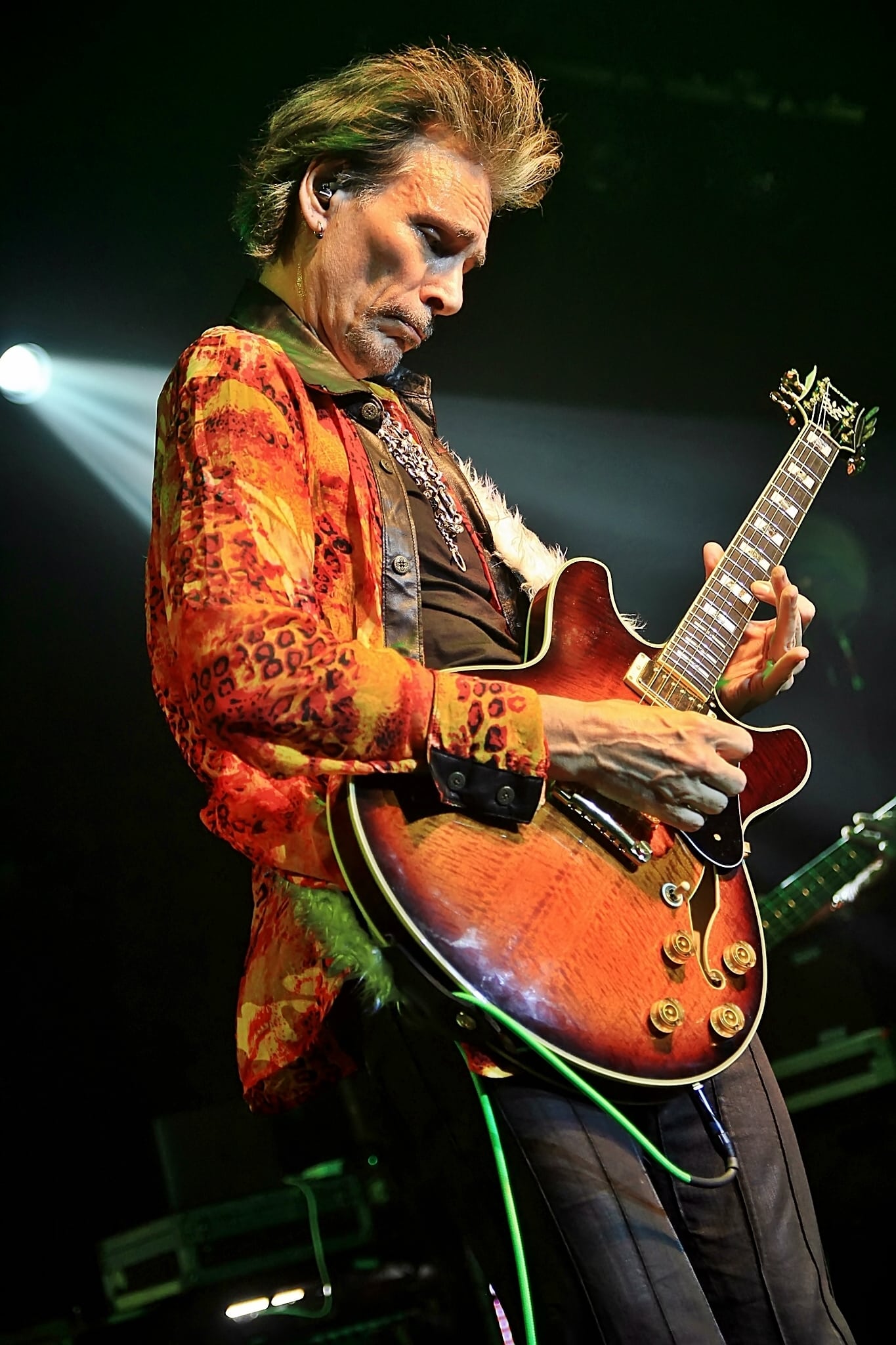 steve vai performing live on stage in 2022